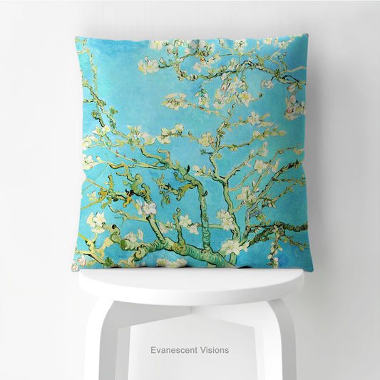 A square decorative cushion featuring Vincent van Gogh's 'Almond Blossom' painting design, shown styled on a stool.