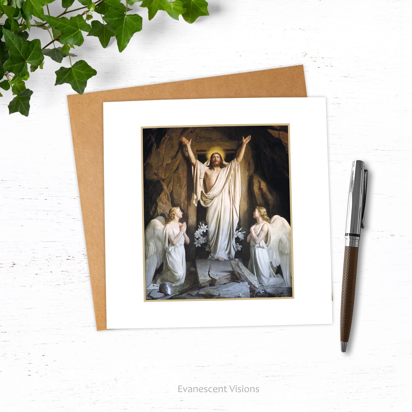 Card and envelope. Card design is Christ and angels from painting by Carl Heinrich Bloch, 'The Resurrection.' Card and envelope are shown on white surface with nearby pen and branch of ivy.