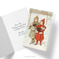 Christmas card with vintage image of two little girls walking in the snow with lots of presents in their arms and an image of the inside of the card with a custom greeting