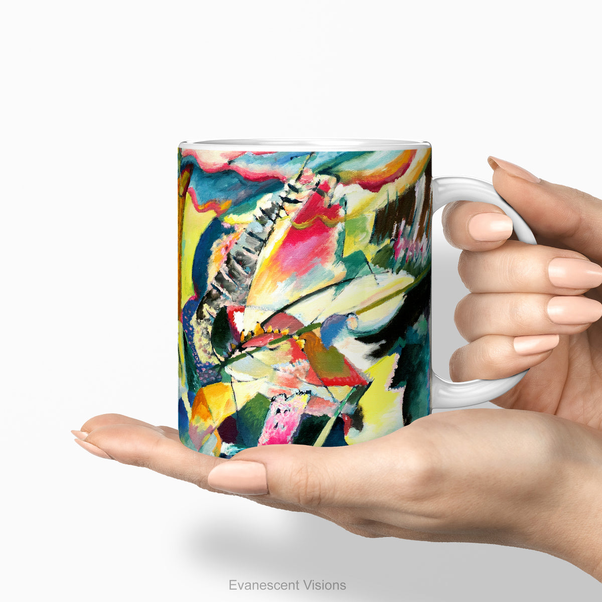 Hands holding aceramic mug featuring abstract painting 'Improvisation Klamm' by Kandinsky.