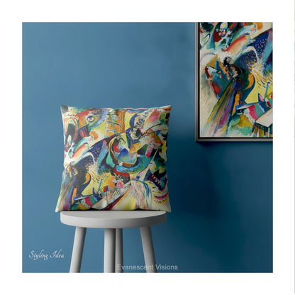 A square cushion featuring the abstract, multicolored painting design 'Improvisation Klamm' by Wassily Kandinsky., shown on a stool against a blue wall.