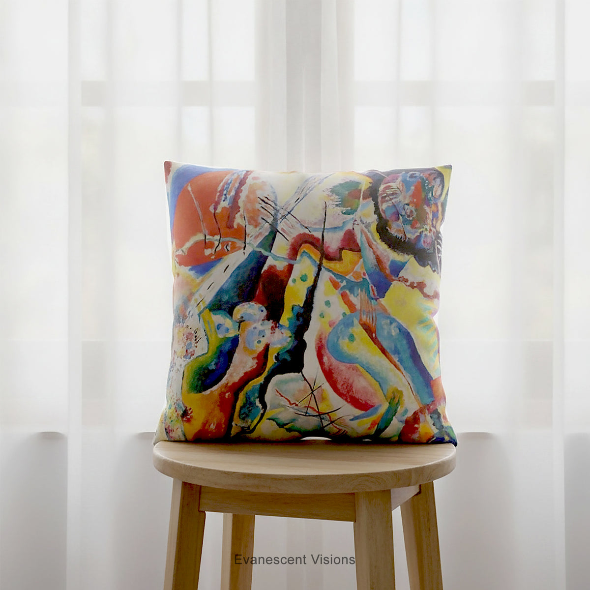 A square cushion featuring a print of the  abstract, multicolored painting 'Bild mit Rotem Fleck' by Wassily Kandinsky, shown on a brown stool.