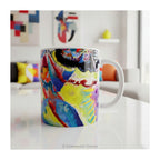 Kandinsky 'Bild mit Rotem Fleck' Mug on a table in a colourful room. 