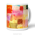 Front view of a white ceramic mug featuring a colorful abstract watercolor print with blocks of teal, yellow, pink, orange, and green called 'Untitled' by artist Paul Klee, shown on a white background. 