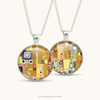 Front and back views of a double sided pendant necklace with pattern detail from artwork 'The Kiss' by Alphonse Mucha