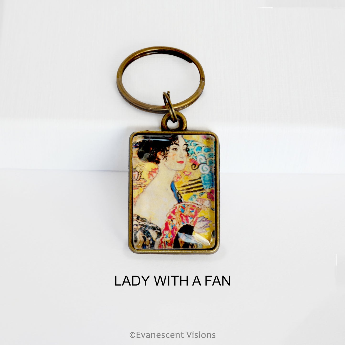 Keychain with a design 'Lady with a Fan' on a white background
