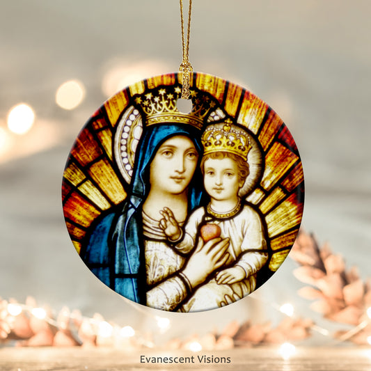 Ceramic Christmas ornament with stained glass window detail of Mary and Jesus. The ornament hangs with a gold thread. 