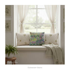 A square decorative cushion  featuring an impressionist floral artwork 'The Artist's Garden' by Claude Monet, on a window box with neutral decor. 