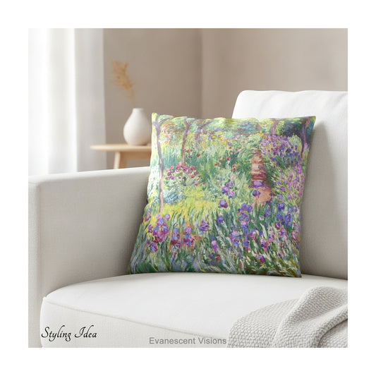 A square decorative cushion  featuring an impressionist floral artwork 'The Artist's Garden' by Claude Monet, on cream coloured sofa.