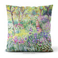 A square decorative cushion  featuring an impressionist floral artwork 'The Artist's Garden' by Claude Monet.