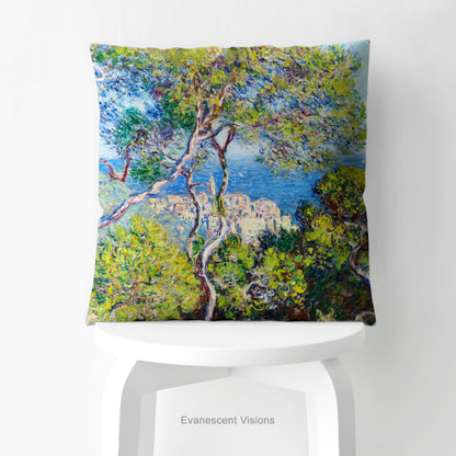 A square decorative cushion  printed with with Monet's Bordighera painting,  on white stool