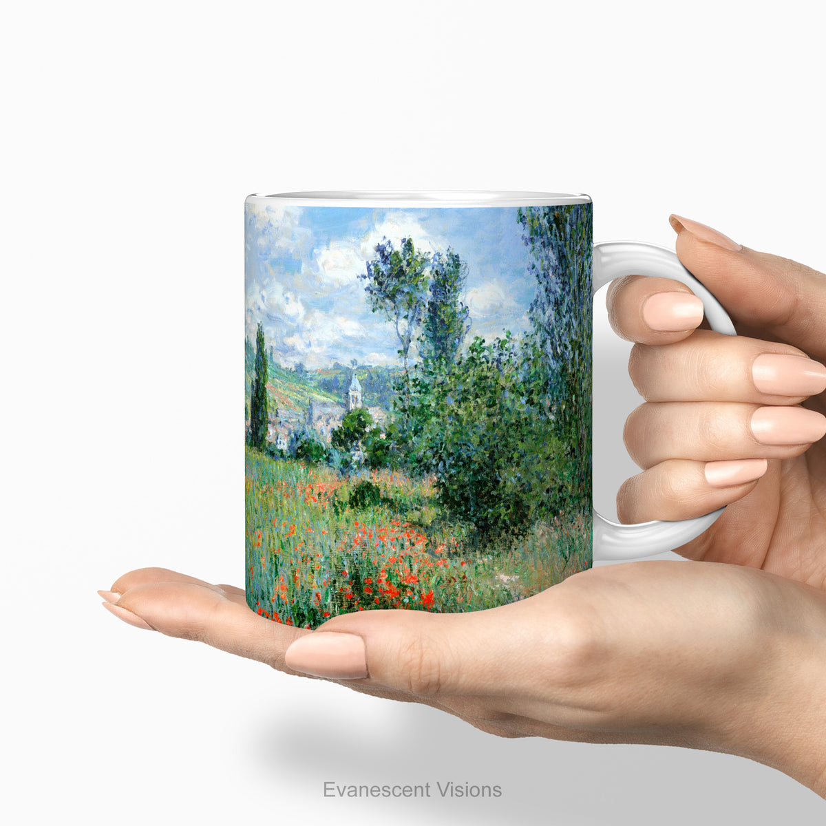 Hands holding the ceramic mug with print of painting 'View of Vétheuil' .