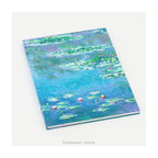 A hardback notebook printed with the   impressionist Water Lily painting in blues and greens by artist Claude Monet, on a white background. 