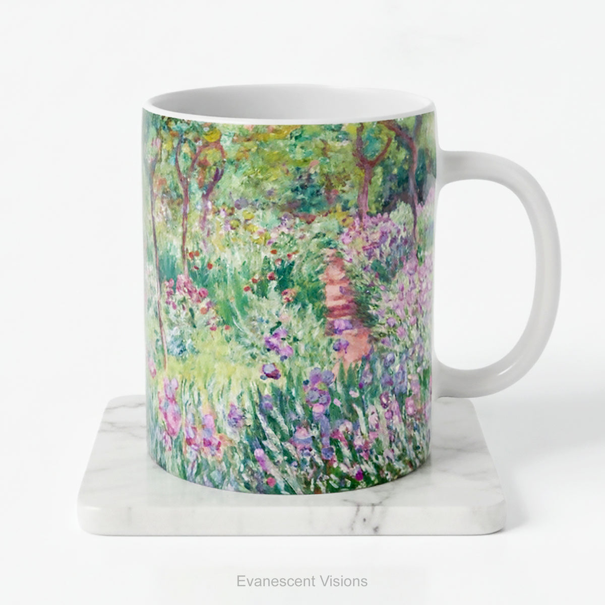 A ceramic mug with a print of artwork The Artist's Garden at Giverney' by Claude Monet