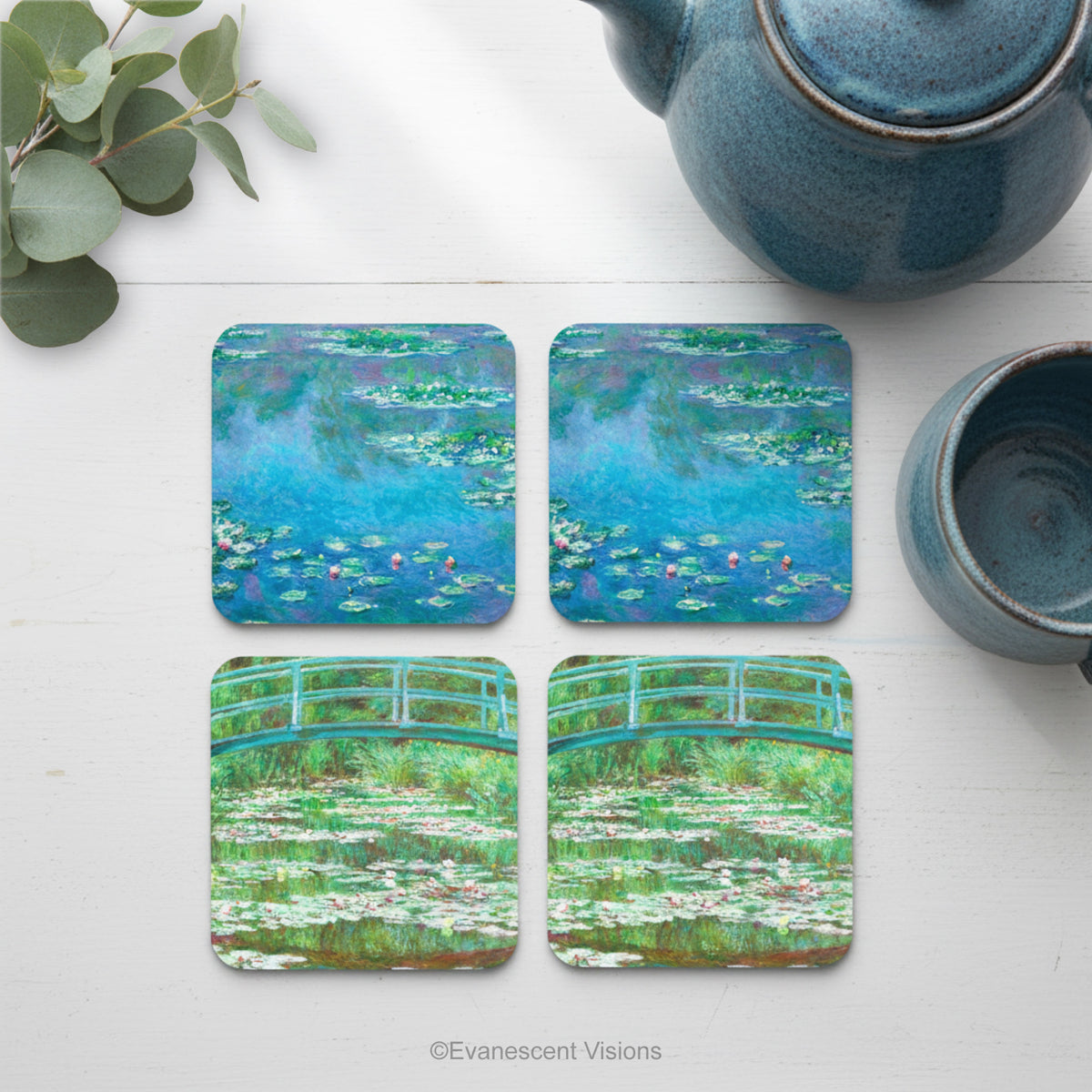 Set of four coasters with images from Monet's paintings 'The Water Lilies' and 'The Japanese Footbridge on a table with tableware. 