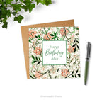 A square floral birthday personalised card with design 'Jasmin' by William Morris, styled with a pen and plant.