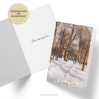 Front and inside view of the Snowy Forest Road Christmas Card , showing an example of a personalised message.