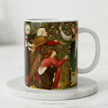 Ceramic mug with artwork depicting the Three Mary's with an Angel.