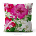 A square pillow with a vibrant floral print  of Vintage petunia flowers with green leaves by Japanese artist, Tanigami Kônan. 