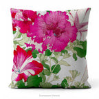 A square pillow with a vibrant floral print  of Vintage petunia flowers with green leaves by Japanese artist, Tanigami Kônan. 