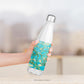 Van Gogh 'Almond Blossom' design on water bottle held in hand.