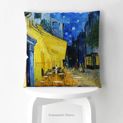 An artistic pillow featuring Vincent van Gogh's Cafe Terrace at Night' painting print shown on a white stool.