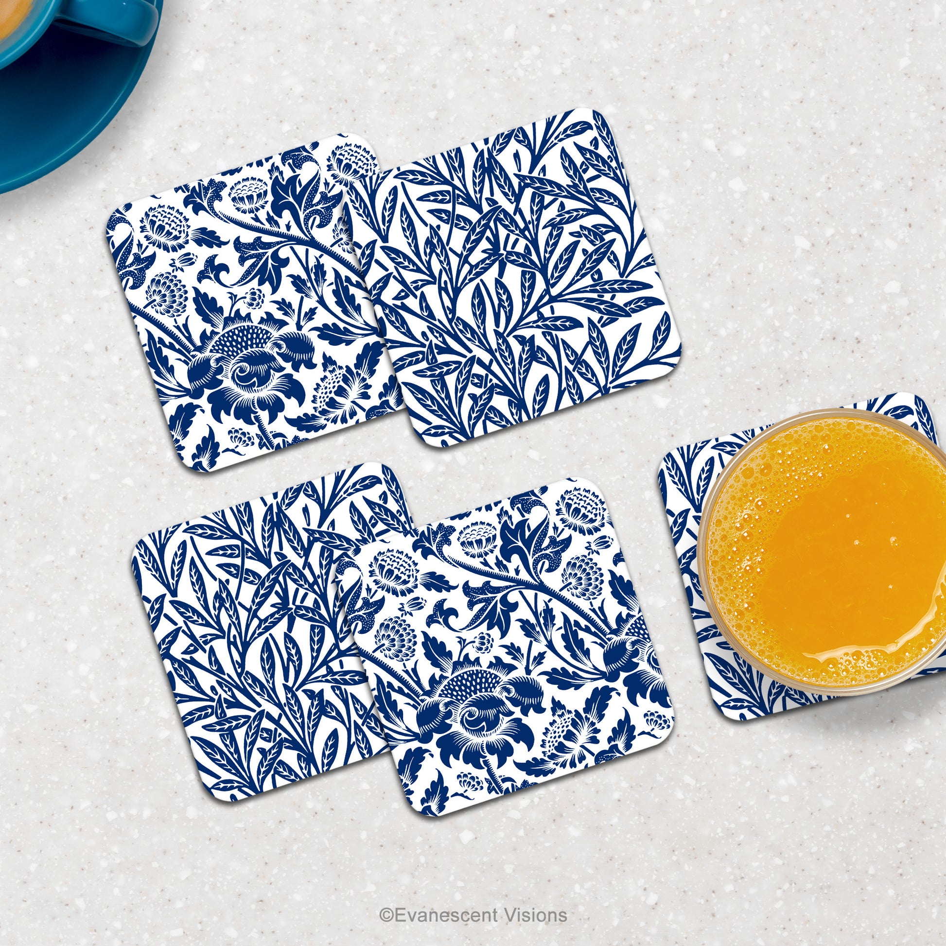 Blue and white floral patterned coasters on countertop with drinks.