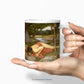 A woman's hand holding the John William Waterhouse Echo and Narcissus Fine Art Mug