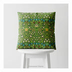 A square decorative cushion on a white stool featuring the floral pattern 'Violet and Columbine' by William Morris.