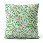 A square decorative cushion with green botanical pattern titled 'Willow Bough' by William Morris.