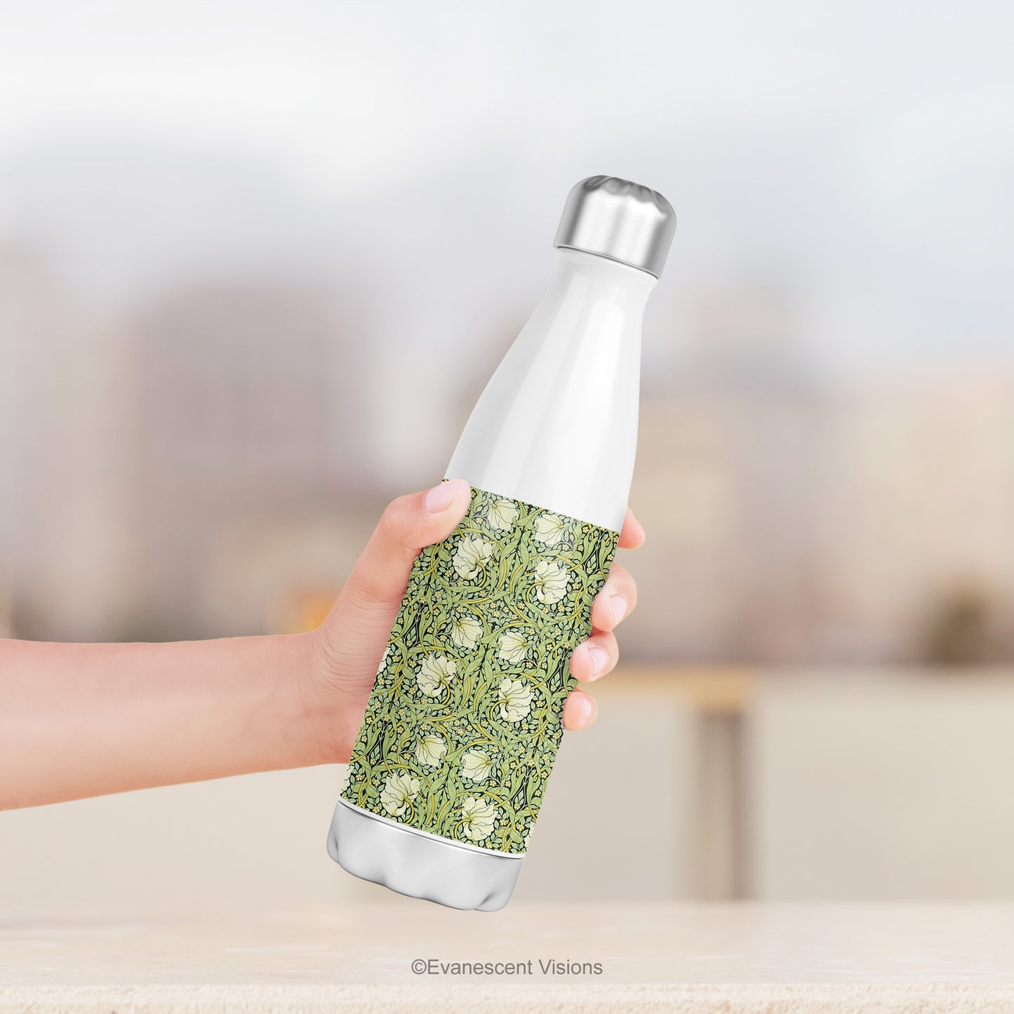 A hand holding a Stainless Steel Water Bottle with the William Morris Pimpernel Design