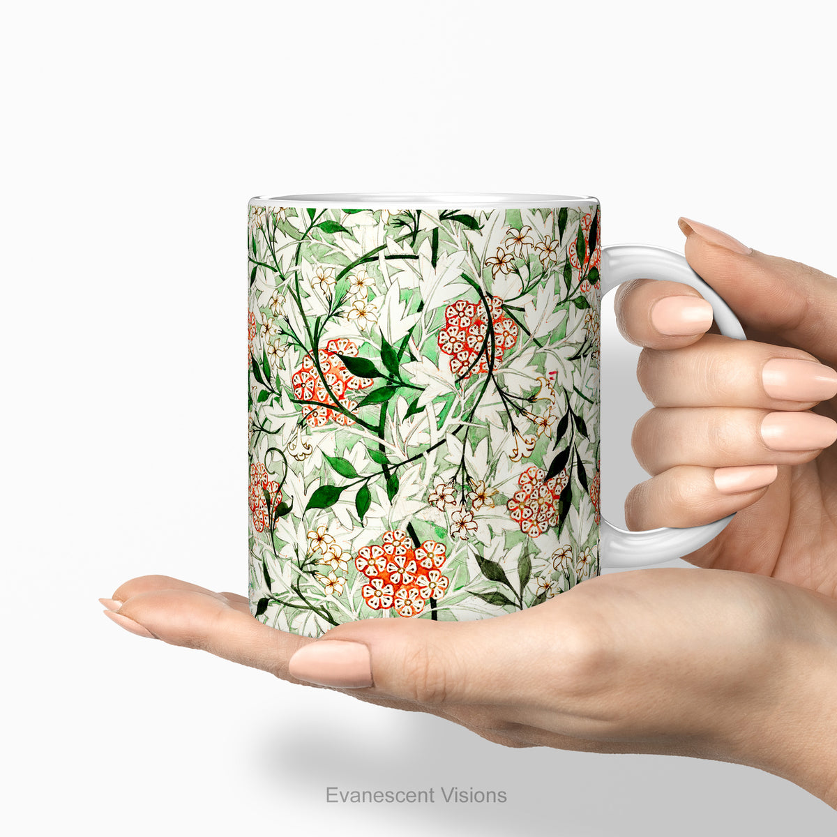 Hands holding a ceramic mug featuring botanical pattern  'Jasmin'  by William Morris.