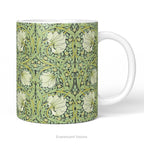 A ceramic mug with floral patterned artwork titled 'Pimpernel' by William Morris. 