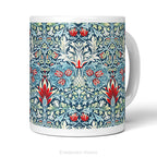 Front view of a white ceramic mug featuring a detailed, symmetrical floral pattern in navy blue, sage green, and red called Snakeshead by William Morris,   shown on a clean white background .