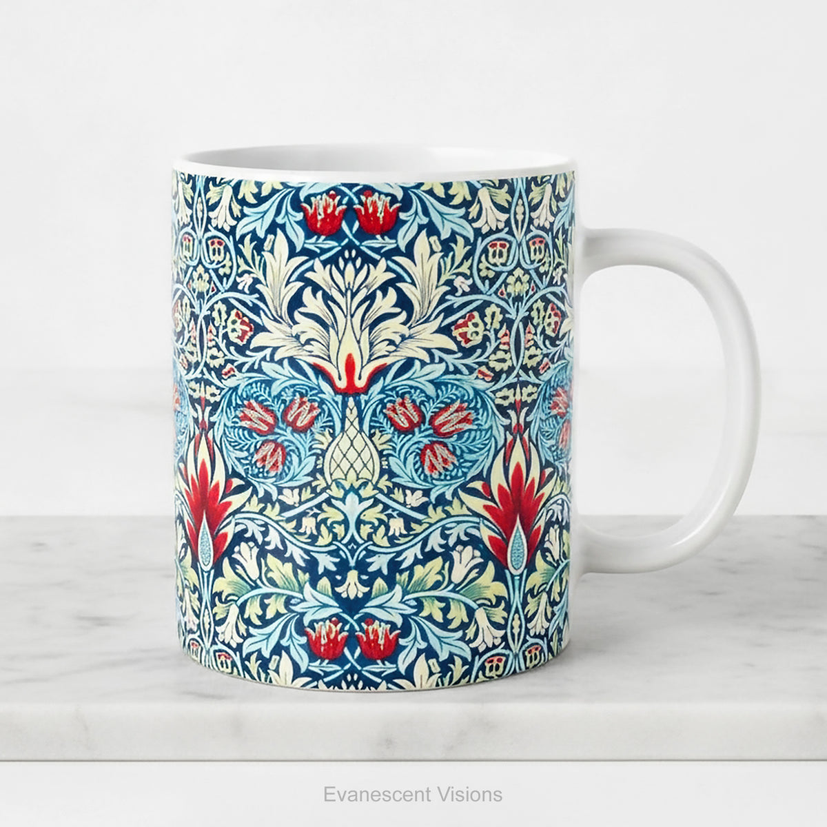 Ceramic mug featuring a print of floral pattern 'Snakeshead' by William Morris, on a white background.
