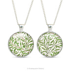 Front and back views of the double sided cabochon pendant necklace with detail from the design  'Willow bough' by William Morris