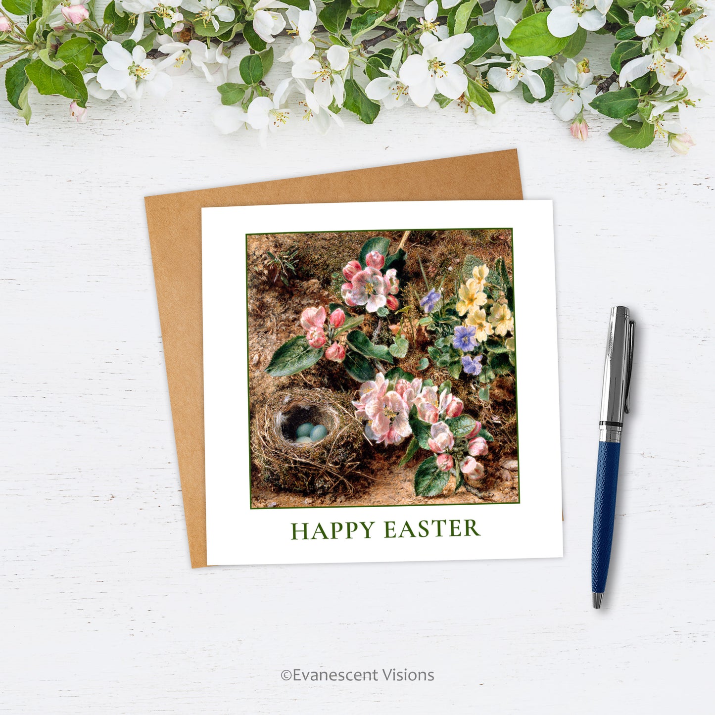 Happy Easter Card and envelope with design, 'Birds Nest, Apple Blossom and Primroses' by William Henry Hunt on white surface with pen and white blossom above.