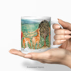 A hand holding a white ceramic mug with Pre-Raphaelite painting 'Deer by a Fountain'   by Edward Burne-Jones, shown on a plain white background. 