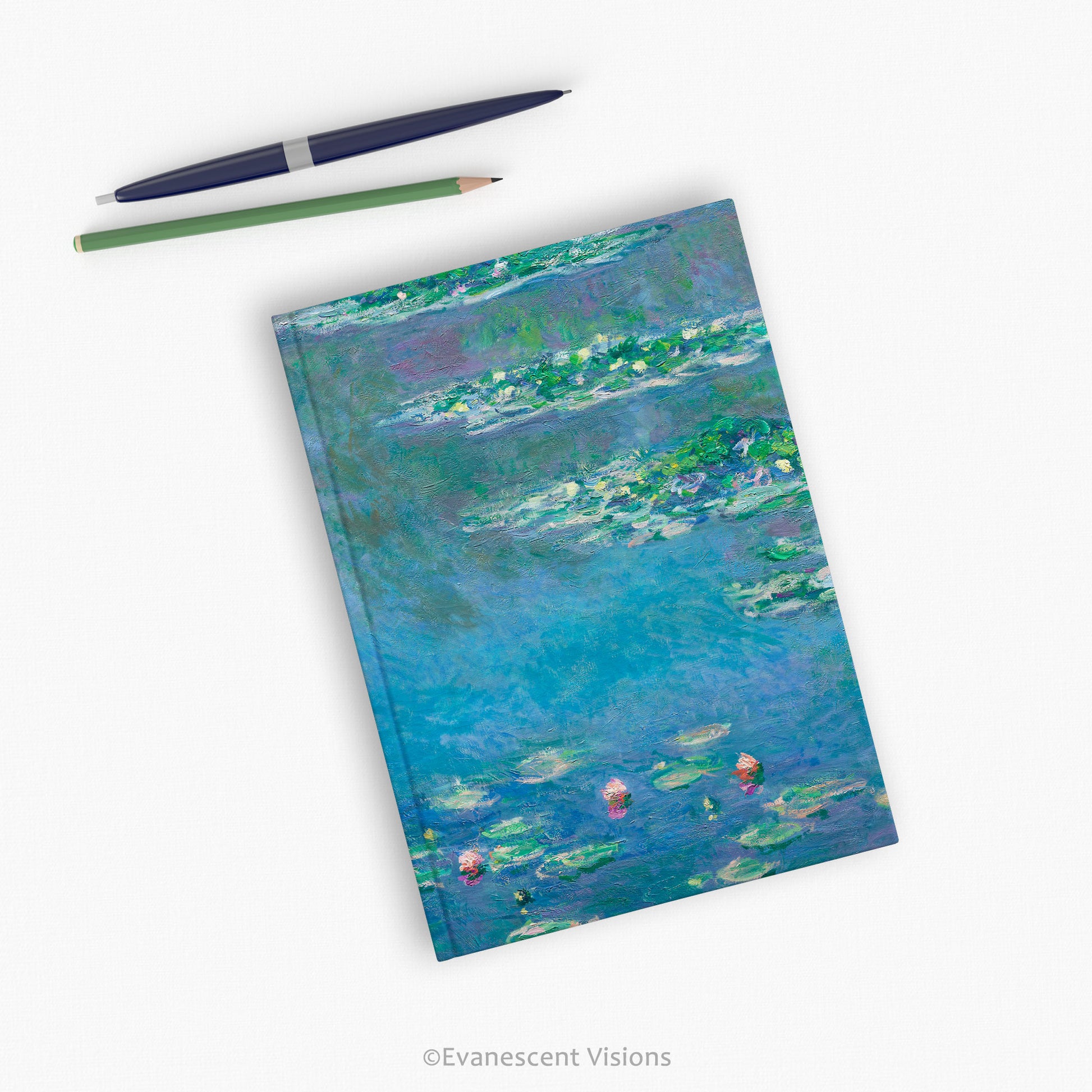 Monet water lilies fine art hardback notebook with pens on a desk