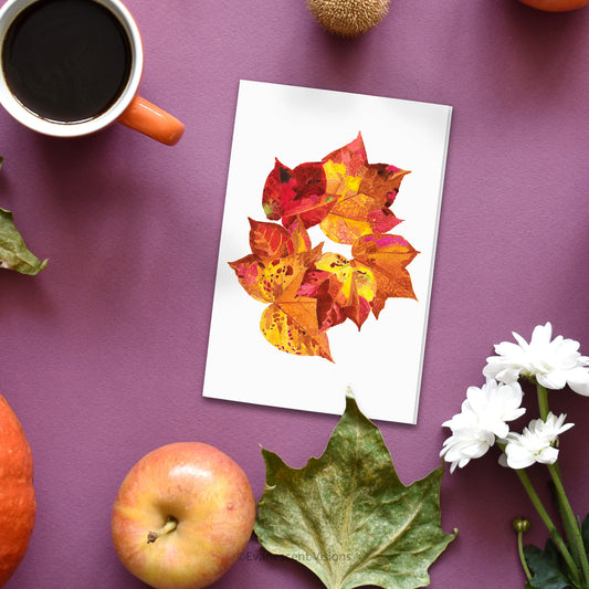 Evanescent Visions Autumn Fall Leaves Greeting Card on table with plants
