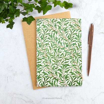 William Morris Art Card, 'Willow Bough' shown on a desk with pen and plant