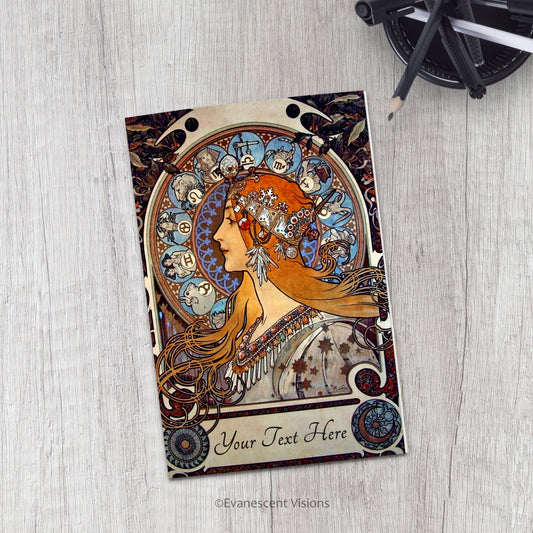 Evanescent Visions Art Nouveau Zodiac Card on a desk with pens